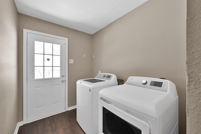 696 Ravensworth Dr, Conroe, TX 77302 - clothes washing area with dark wood-type flooring, separate washer and dryer, laundry area, and baseboards