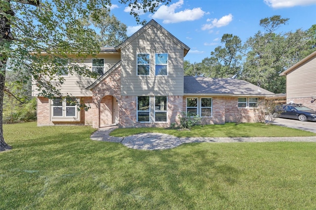 696 Ravensworth Dr, Conroe, TX 77302 - view of front facade featuring a front lawn