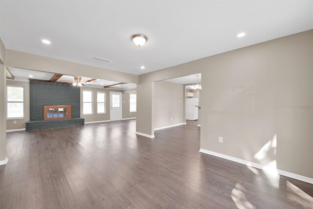 696 Ravensworth Dr, Conroe, TX 77302 - unfurnished living room featuring visible vents, baseboards, and a wealth of natural light