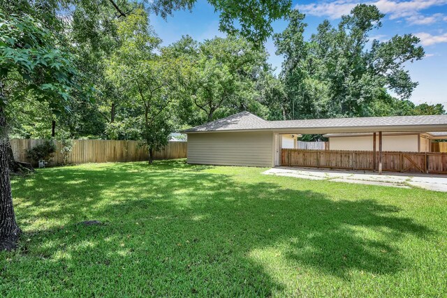 696 Ravensworth Dr, Conroe, TX 77302 - view of yard with a fenced backyard