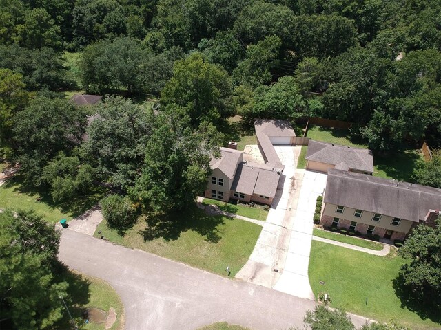 696 Ravensworth Dr, Conroe, TX 77302 - drone / aerial view with a forest view