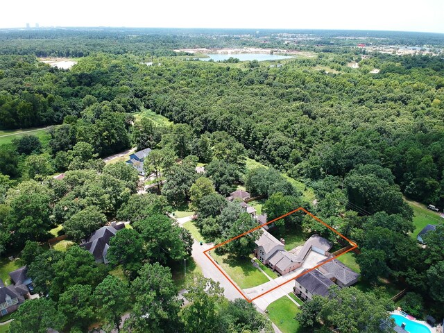 696 Ravensworth Dr, Conroe, TX 77302 - aerial view with a water view and a forest view