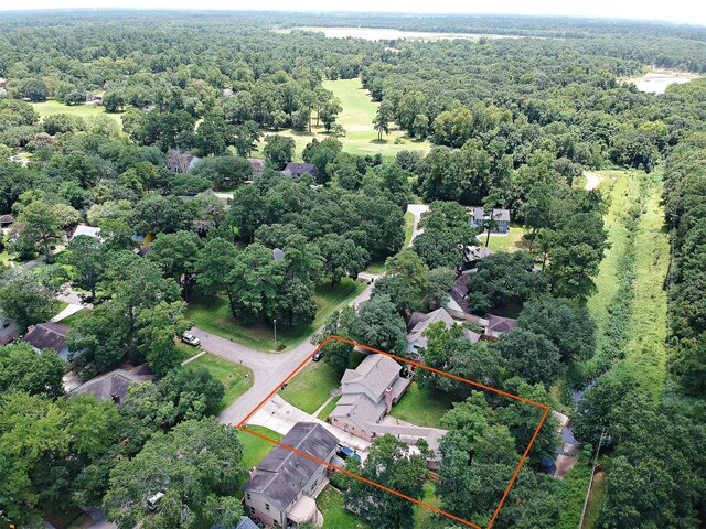 696 Ravensworth Dr, Conroe, TX 77302 - drone / aerial view with a wooded view