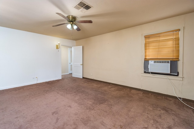 carpeted spare room featuring ceiling fan and cooling unit