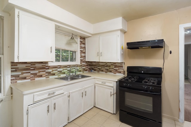 kitchen with decorative backsplash, white cabinetry, and black range with gas cooktop