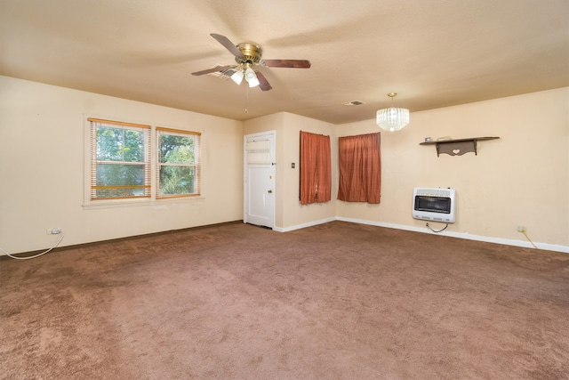 interior space featuring dark colored carpet, heating unit, and ceiling fan