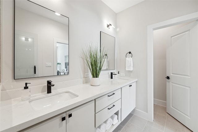 bathroom with vanity and tile patterned floors