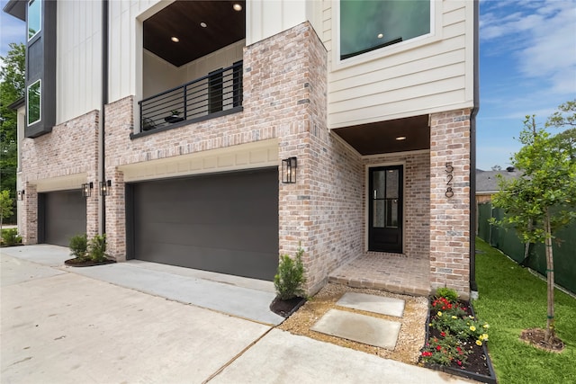 doorway to property with a garage