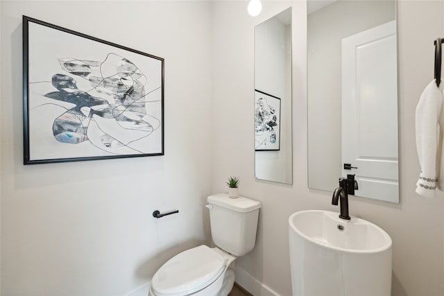 bathroom with sink and toilet