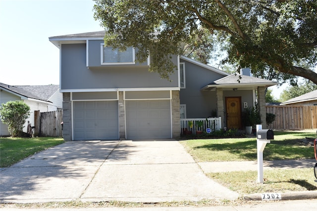 view of front of property with a front lawn and a garage