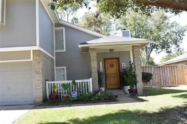 view of front of home with a front lawn and a garage