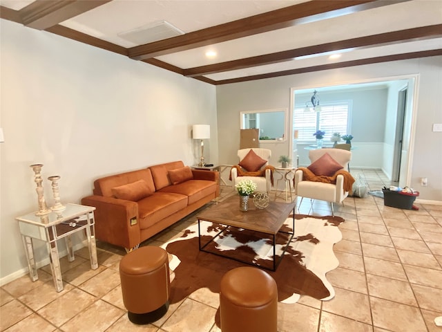 tiled living room featuring beamed ceiling and ornamental molding