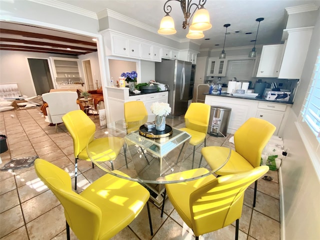 dining space featuring a chandelier and crown molding