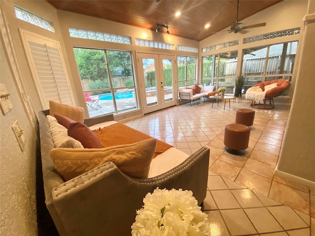 sunroom featuring french doors, ceiling fan, wooden ceiling, and vaulted ceiling