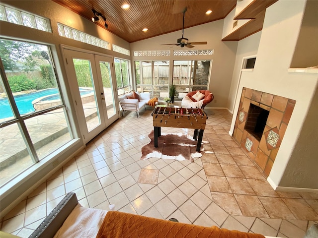 game room with french doors, ceiling fan, light tile patterned floors, and wooden ceiling