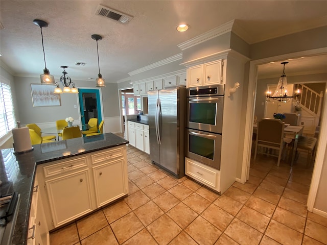 kitchen with stainless steel appliances, plenty of natural light, and white cabinets