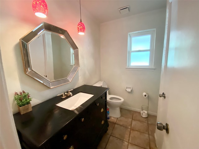 bathroom featuring vanity, toilet, and tile patterned floors