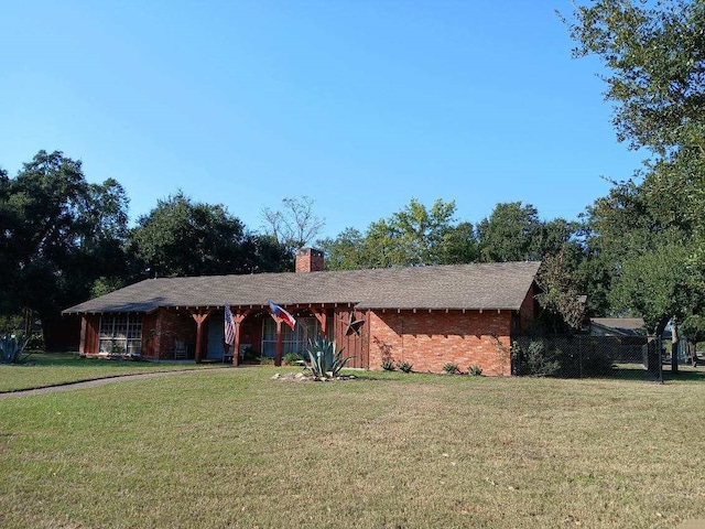 ranch-style house with a front lawn