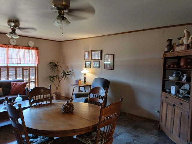 dining area featuring ceiling fan and ornamental molding