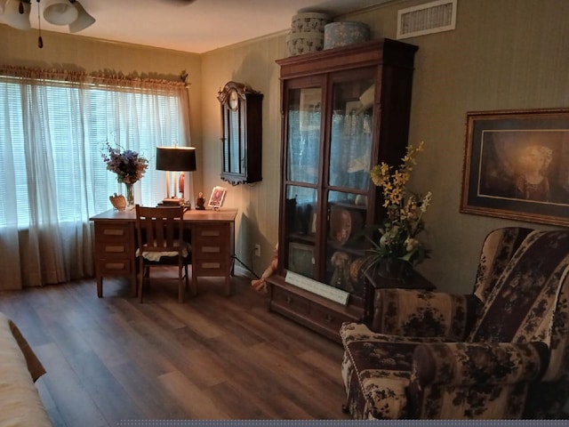 home office with wood-type flooring and ceiling fan