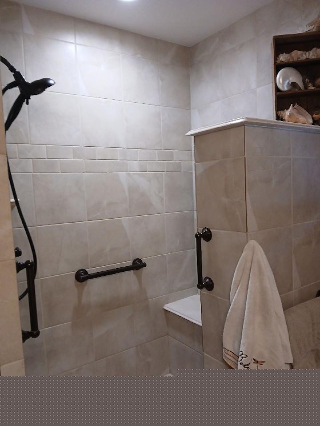 bathroom with a tile shower