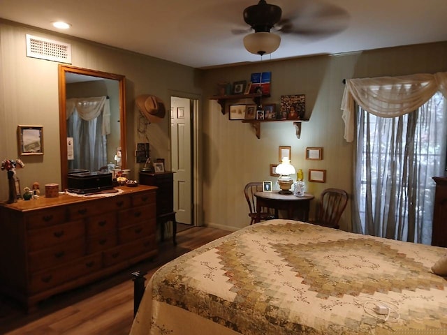 bedroom featuring ceiling fan and dark wood-type flooring