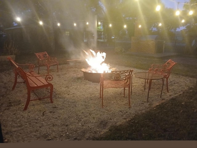 view of patio / terrace featuring a fire pit