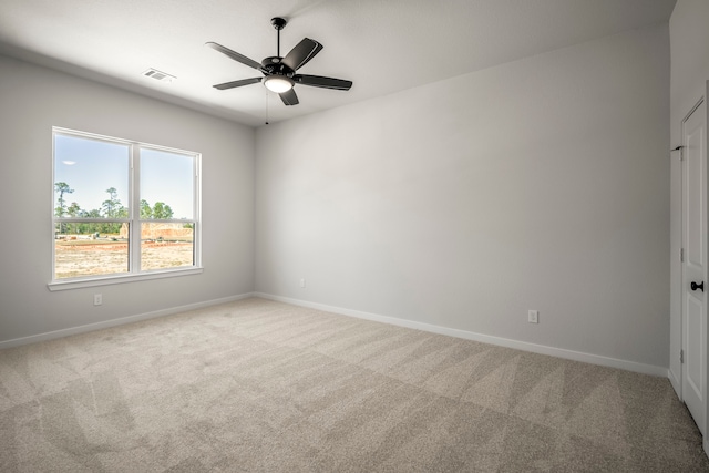 carpeted empty room with ceiling fan