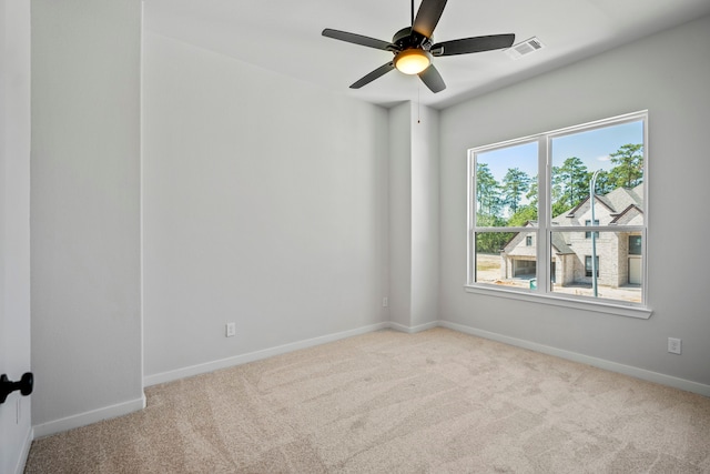 carpeted empty room with ceiling fan