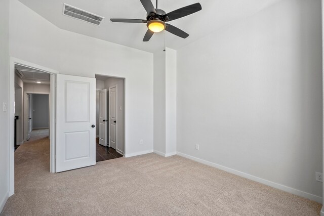 carpeted empty room with ceiling fan