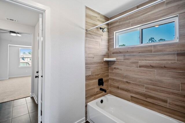 bathroom featuring tiled shower / bath, tile patterned floors, and ceiling fan