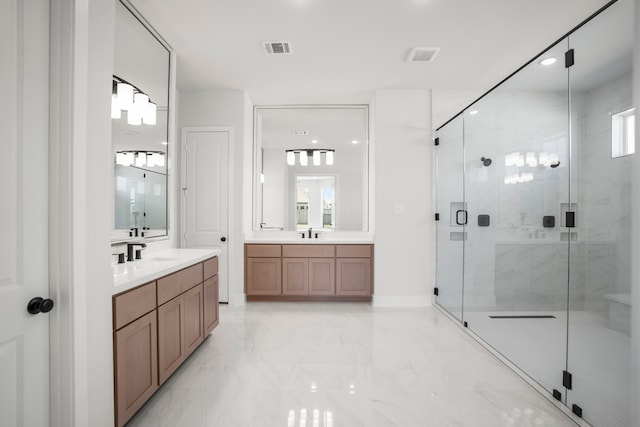 bathroom featuring vanity and a shower with shower door