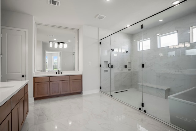 bathroom featuring vanity and an enclosed shower