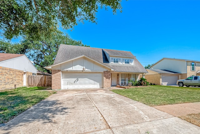 view of front of home featuring a garage and a front lawn