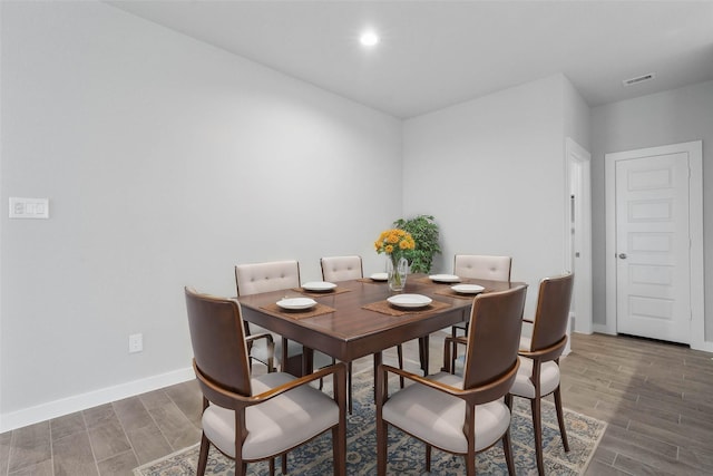 dining space with recessed lighting, visible vents, baseboards, and wood finish floors