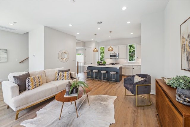 living room with light hardwood / wood-style floors