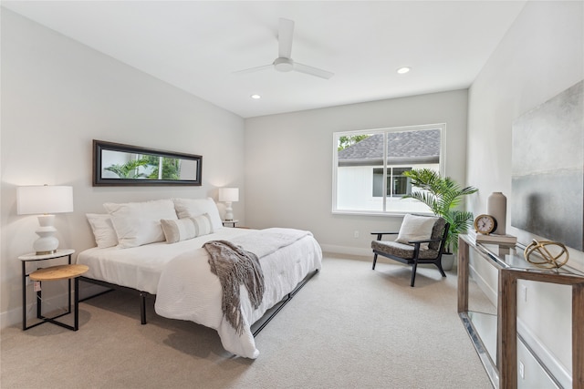 bedroom featuring light carpet and ceiling fan