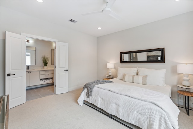 bedroom featuring light colored carpet and ceiling fan