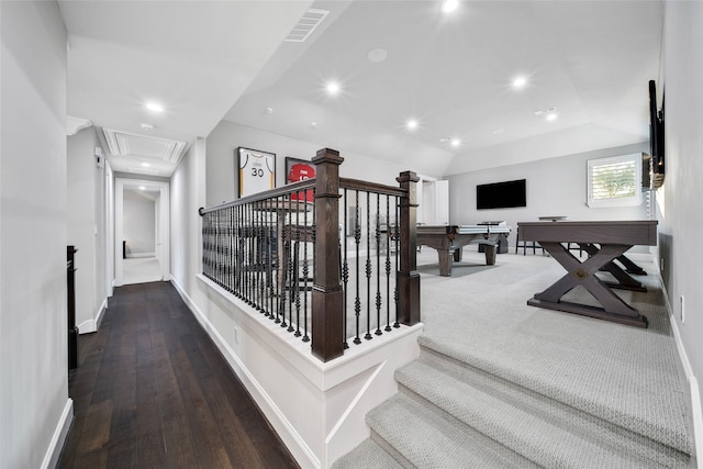 staircase featuring wood-type flooring