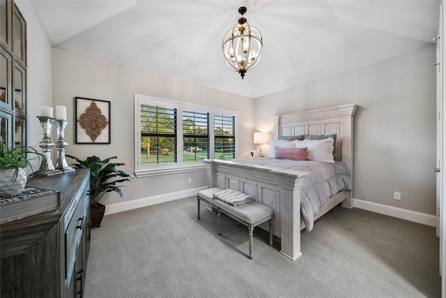 carpeted bedroom with lofted ceiling and an inviting chandelier