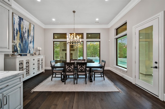 dining space with dark hardwood / wood-style flooring, crown molding, and an inviting chandelier