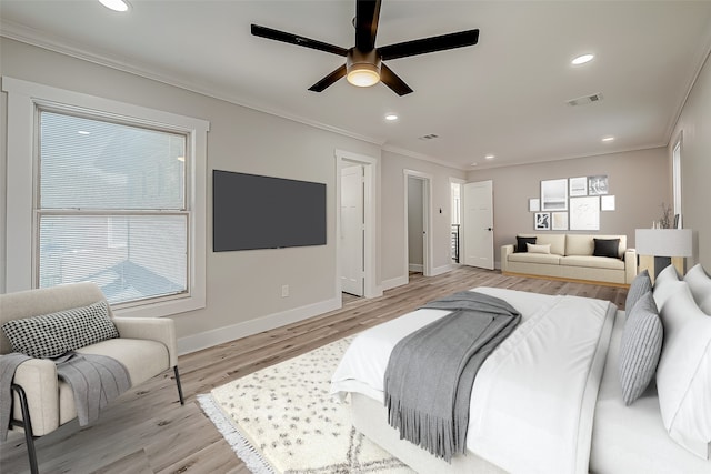 bedroom featuring crown molding, light hardwood / wood-style flooring, multiple windows, and ceiling fan