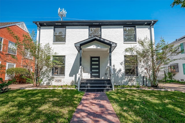 view of front of house with a front lawn