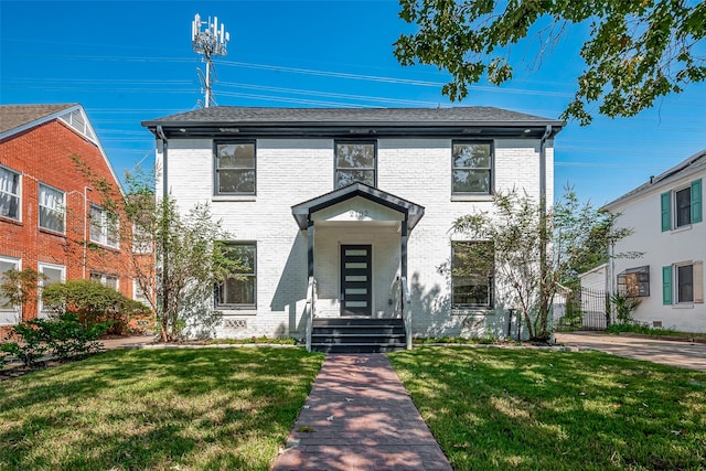 view of front of home featuring a front lawn