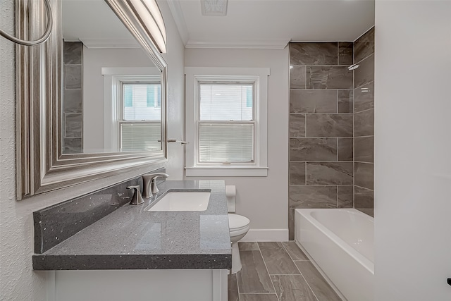 full bathroom with vanity, crown molding, tiled shower / bath combo, and toilet