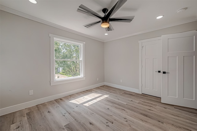 unfurnished room with light hardwood / wood-style floors, crown molding, and ceiling fan