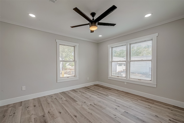 spare room with light hardwood / wood-style floors, crown molding, and ceiling fan