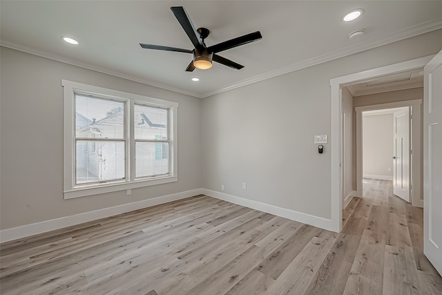 empty room with light hardwood / wood-style floors, ornamental molding, and ceiling fan