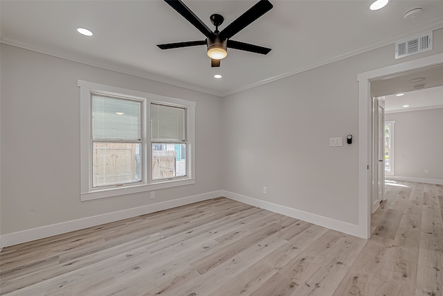 spare room featuring light hardwood / wood-style floors, crown molding, and ceiling fan