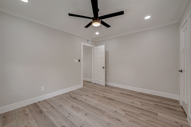 spare room with ceiling fan, ornamental molding, and light wood-type flooring